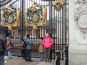 Kayla outside the gates of Buckingham Palace