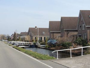"Driveway bridges" leading to houses in a small town on the way to Rotterdam
