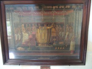 A painting of the large gold pot the King would clean in (5 times) to become purified. The contents would contain a mixture of oils, cow urine and faeces, among other things.