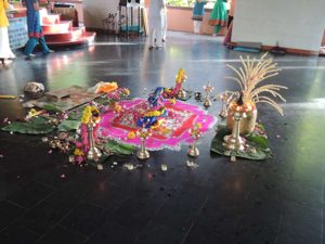 The display after the priest had done his thing and we'd all thrown flowers on it.